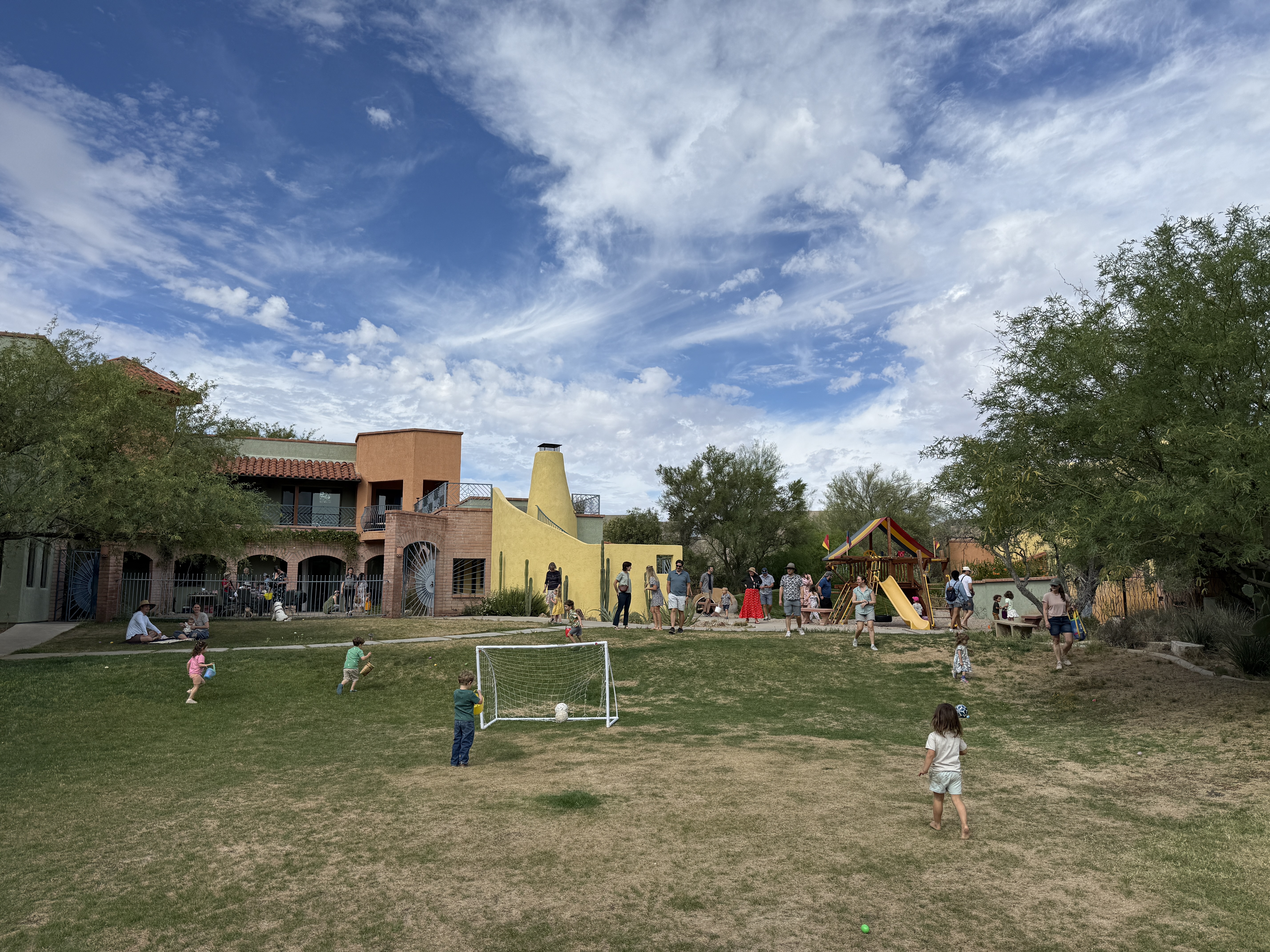 Kids and neighbors gathering on the community lawn
